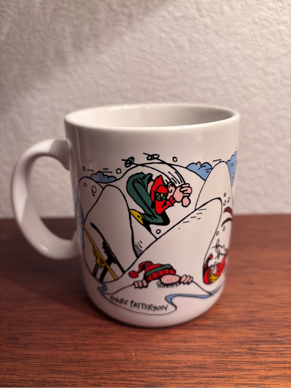 Gary Patterson White Ceramic Ski Cartoon Mug with Red and Green Accents